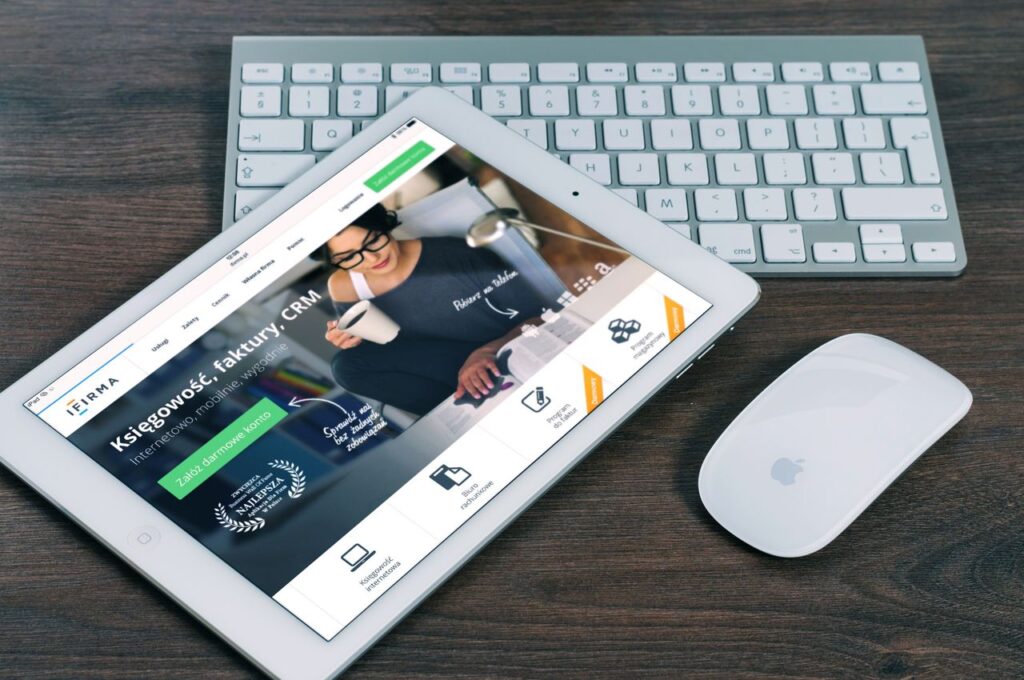 Mastering the First Impression: Your intriguing post title goes here A tablet with a financial website open, alongside a white keyboard and mouse. Ideal for tech-theme stock images.