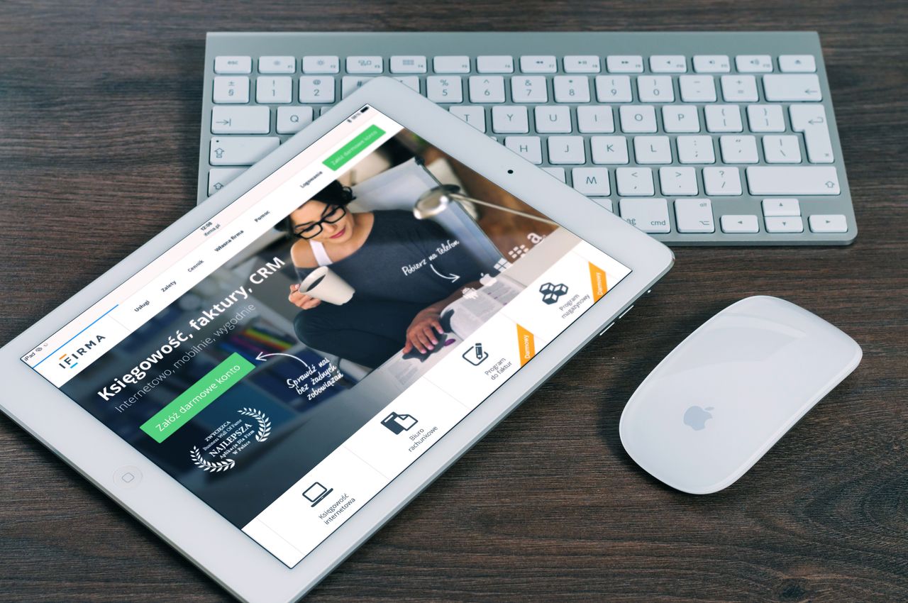 Mastering the First Impression: Your intriguing post title goes here A tablet with a financial website open, alongside a white keyboard and mouse. Ideal for tech-theme stock images.